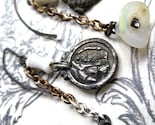 White. Religious Medal and Opalecent Drop Earrings.