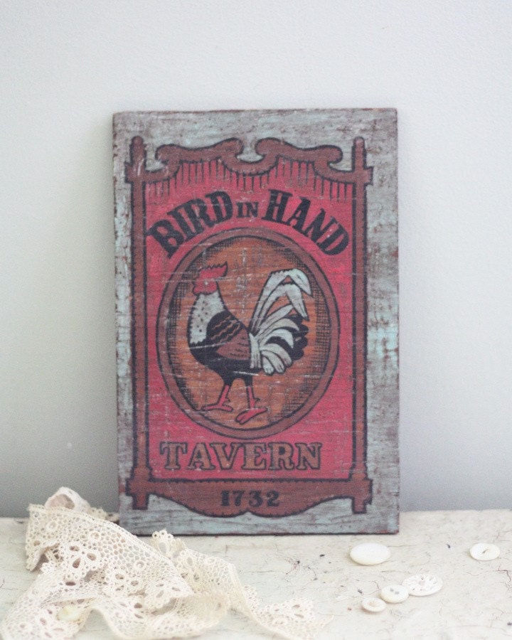 Bird in Hand. Vintage rustic wooden rooster tavern plaque.