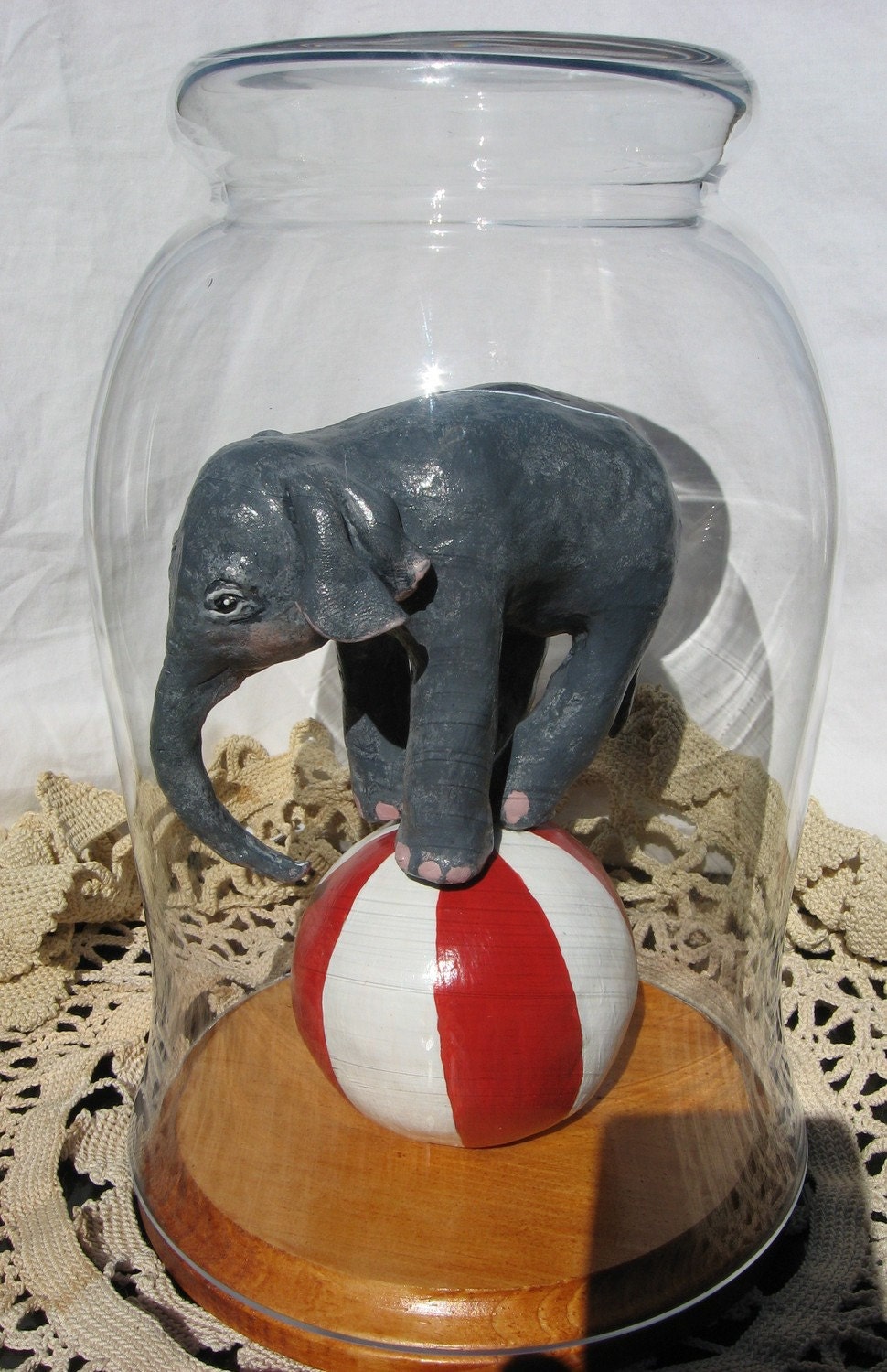 Baby Elephant on Red and White Striped Ball
