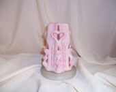 Pink carved candle with heart