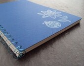 book journal, blue cover with white flower, writing journal