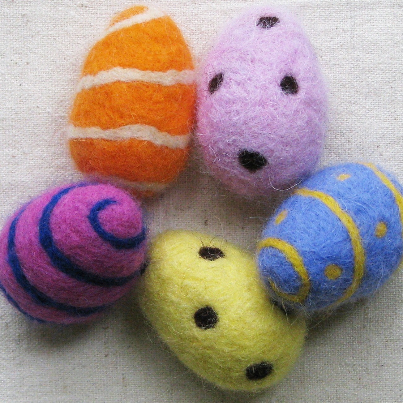 EASTER EGG, needle felted from wool in fuchsia pink with cobalt blue spiral stripe