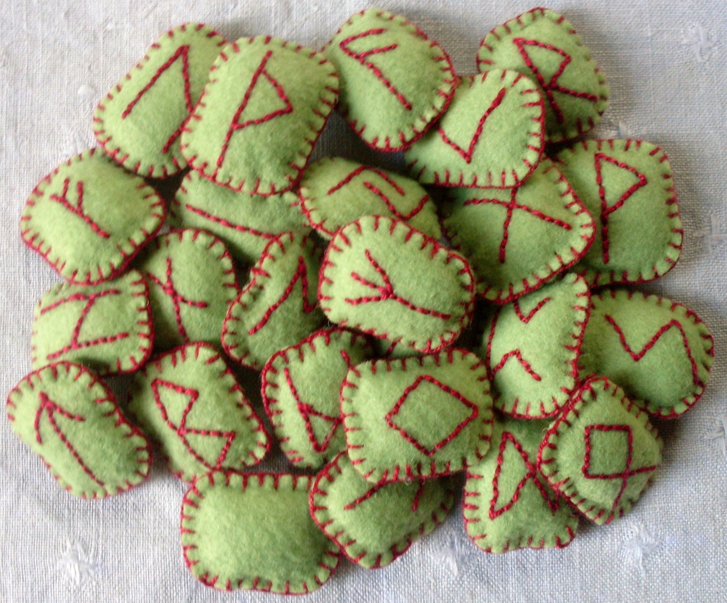 Green Felt Rune set filled with rosemary