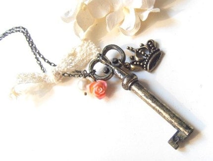 Queen of Couture. Antiqued victorian skeleton key pendant with a romantic crown charm necklace.