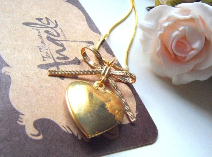 Coeur. Vintage heart shaped french locket with romantic brass ribbon necklace.