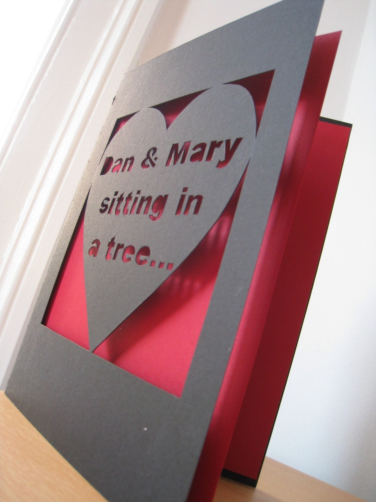 Hand Cut Personalised 'sitting in a tree' Valentine's or Anniversary Card
