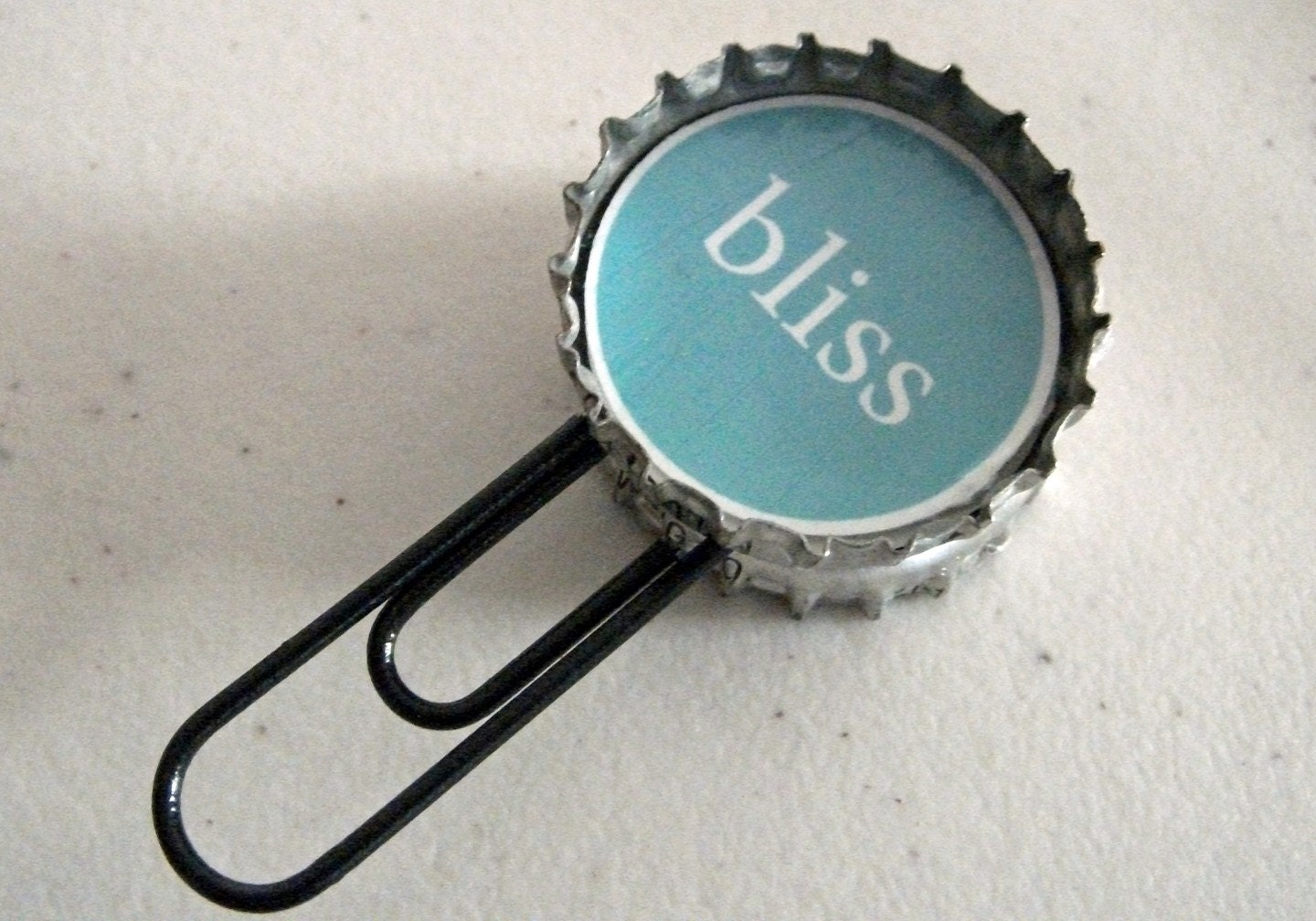 Bliss and Grow recycled bottle cap bookmark
