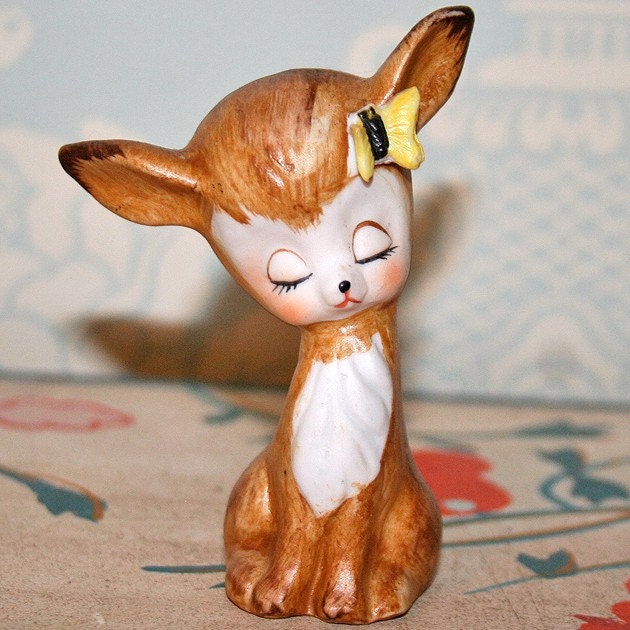 Adorable deer figurine with little yellow butterfly