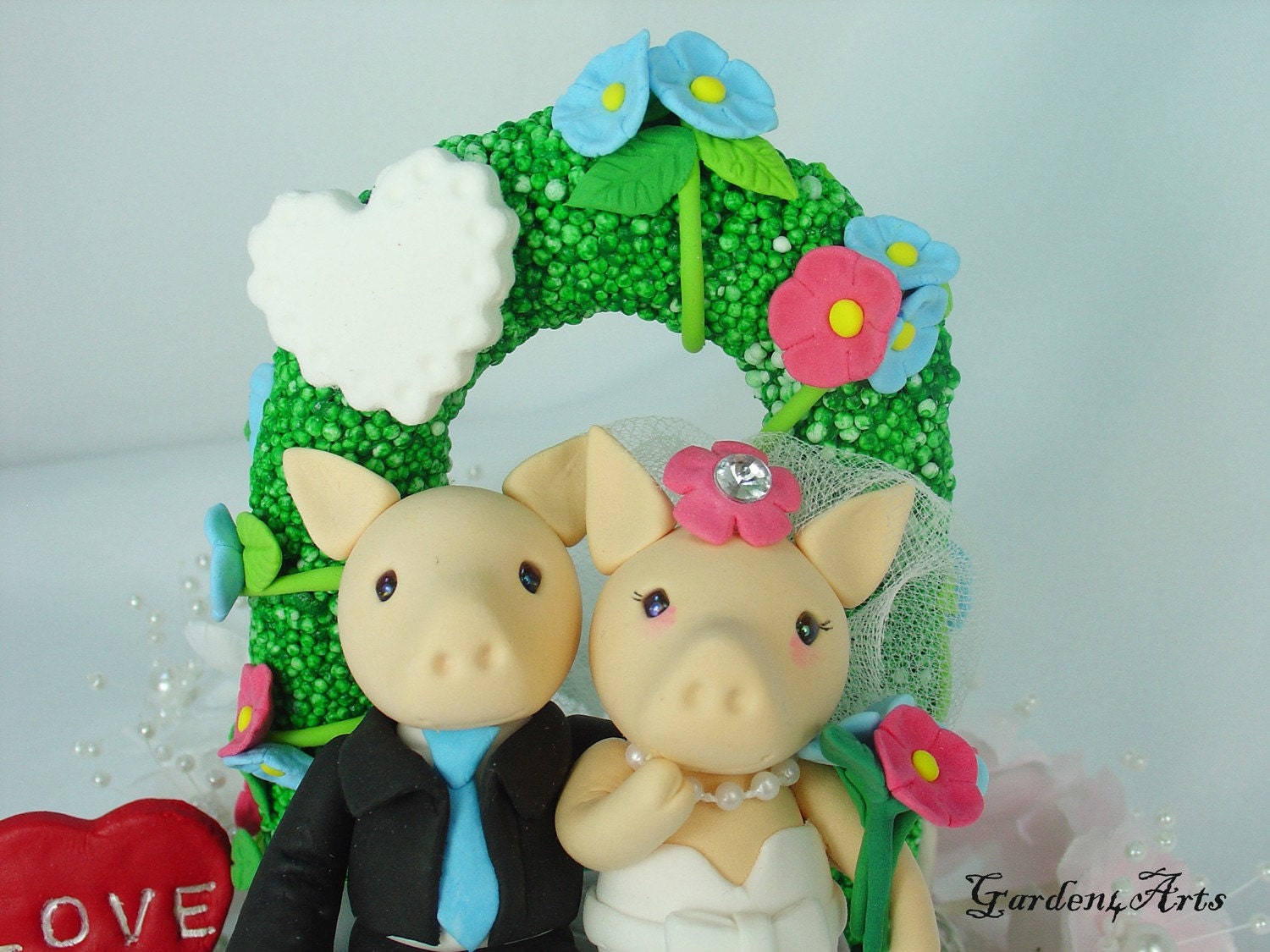 Love piggy couple with sweet bench/flower arch and grass base -custom order for southern wedding