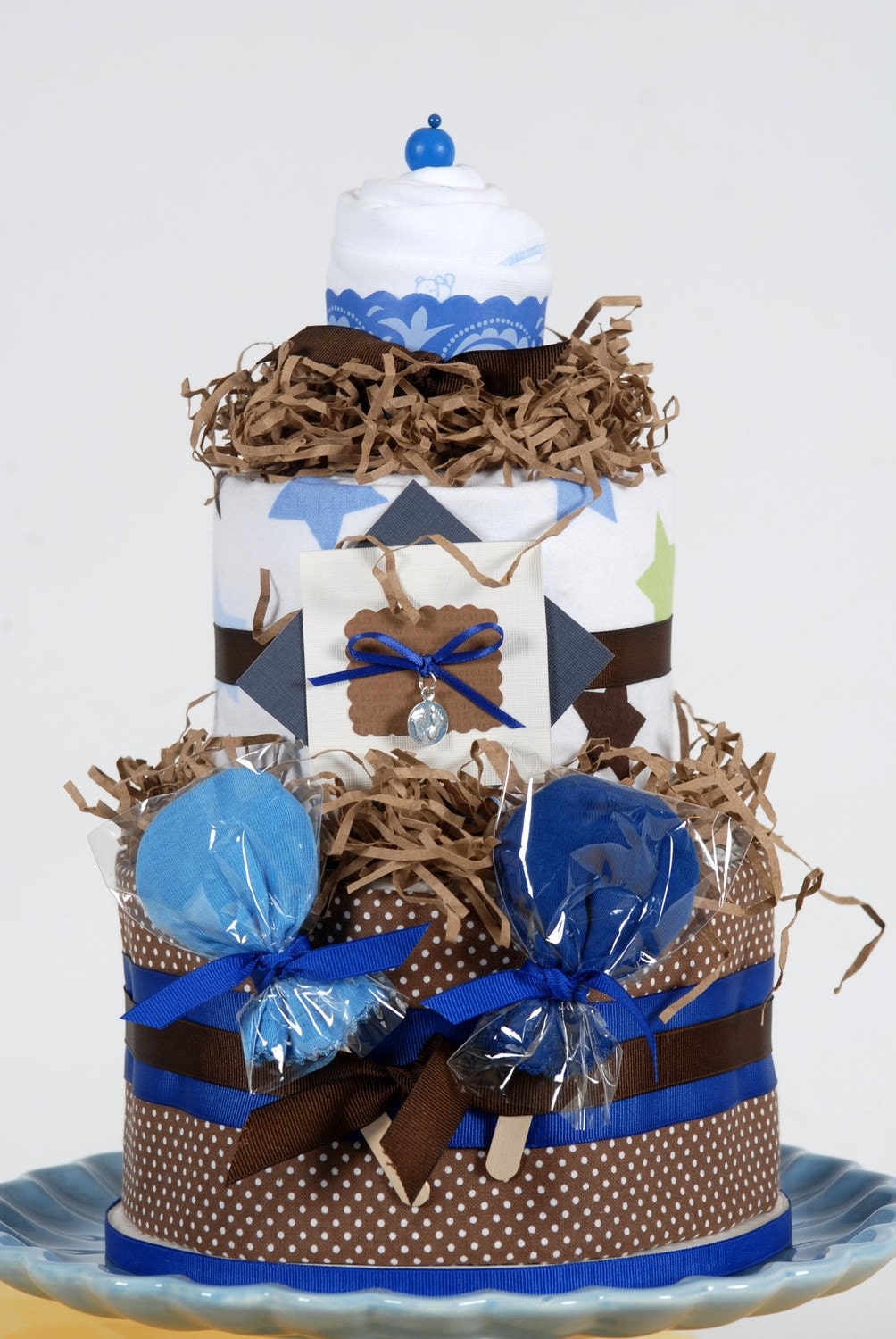 Blue and Brown Boy Diaper Cake Cupcake Onesie Gift Set The Riley   baby shower   ایده برای تزیین سیسمونی  نوزاد و فرشته كوچولو جشن سیسمونی یا