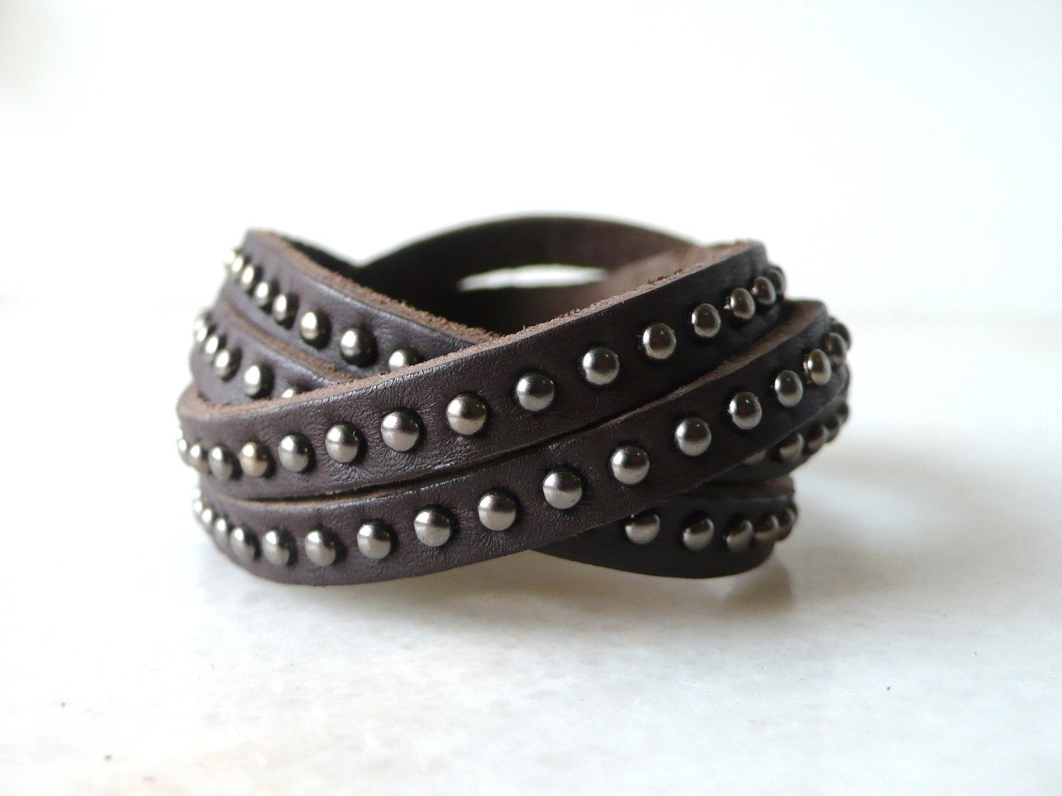 Dark brown cowhide wrapped leather bracelet with brown metal rivets