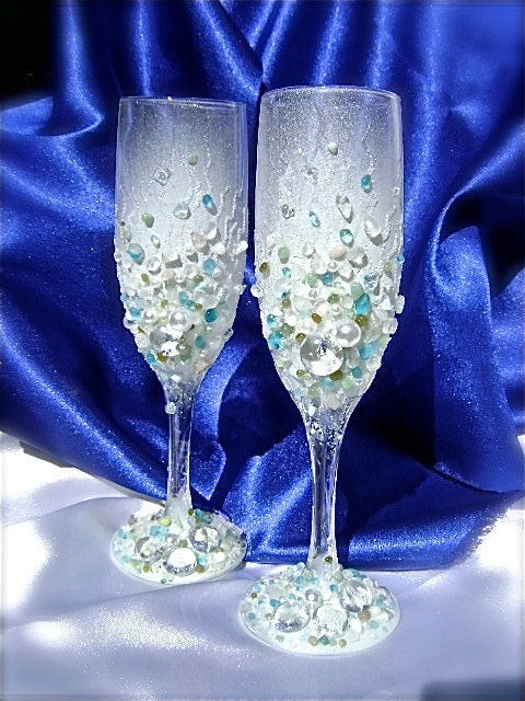 A beautiful pair of hand decorated wedding champagne glasses