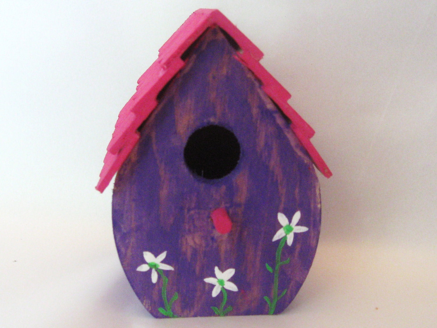 Mini birdhouse, purple and pink, scalloped roof, tiny painted white flowers.