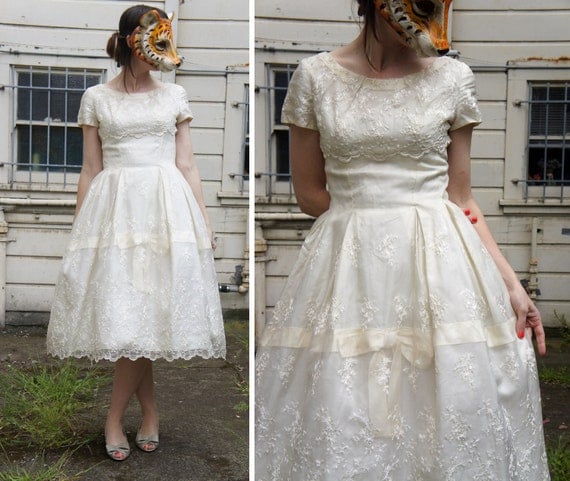  wearing a vintage tea length or shorter wedding dress if that means 