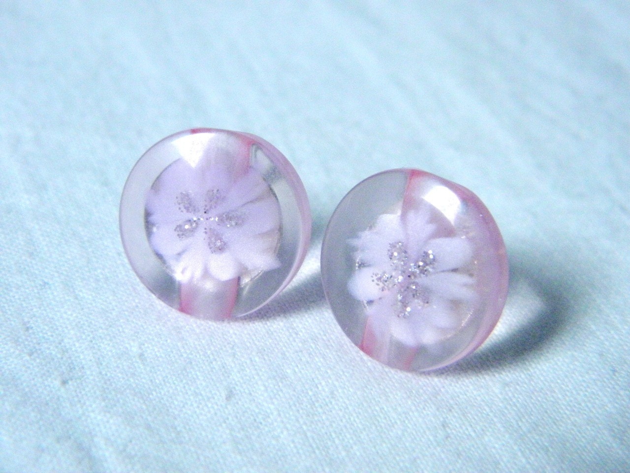 Plastic button earrings pink color