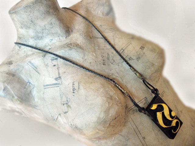 A for Aberash. Woodblock Print Long Black Necklace with gold leaf.