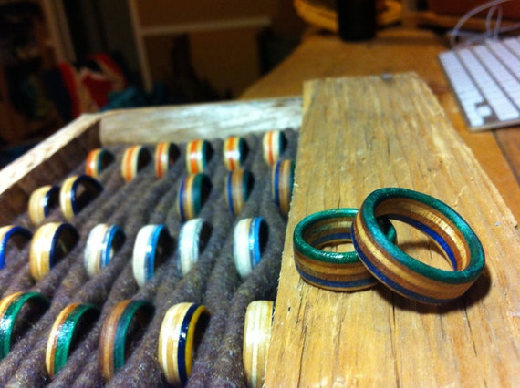 Rings with a  green & blue stripe hand cut from skateboard decks