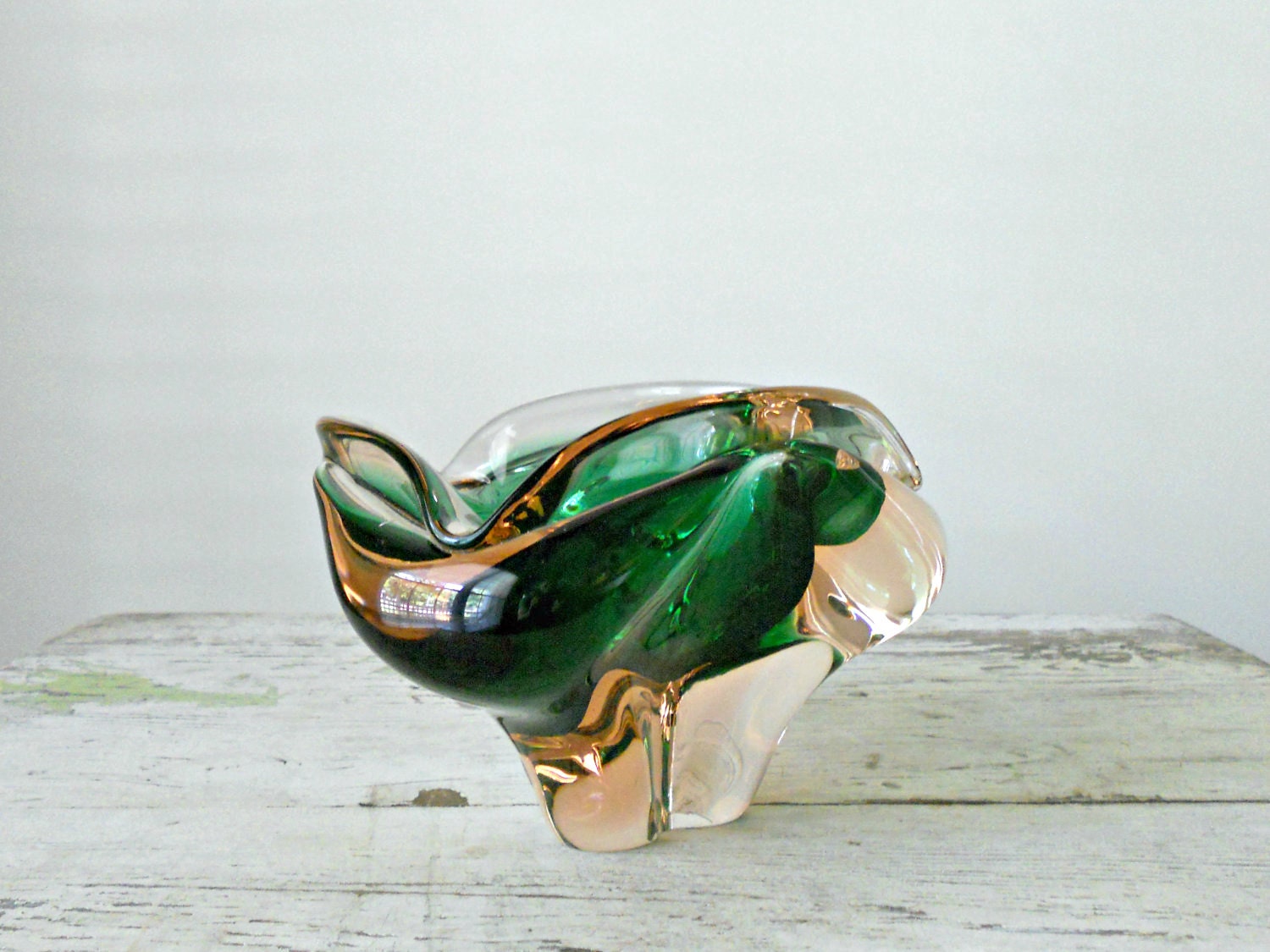 freeform organic glass bowl in gold, clear, and emerald green