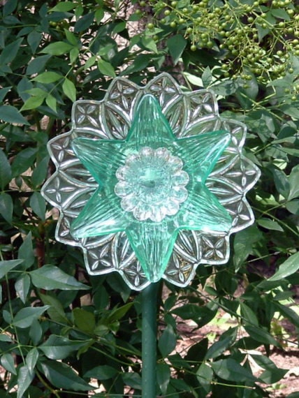 Garden art flower suncatcher made with repurposed glass.  Aqua glass flower suncatcher.